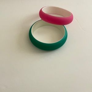2 pink and green plastic bangles